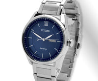 A blue dial silver band Citizen on a light silver and white background. ,