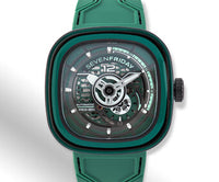 A green SevenFriday watch on a light silver and white background. ,