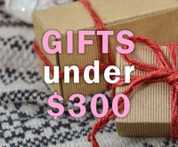 The text reads "gifts under $300" The background shows presents. ,